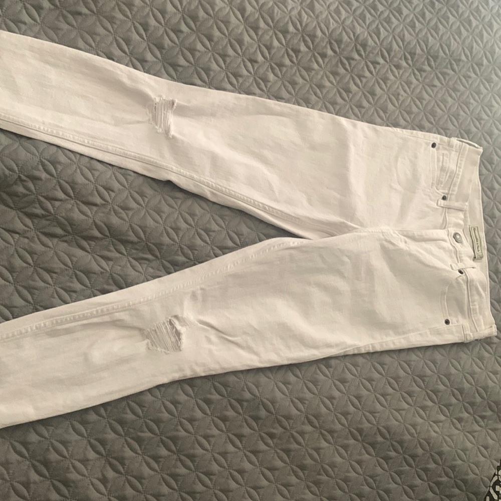 White ripped skinny jeans from Abercrombie & Fitch (: